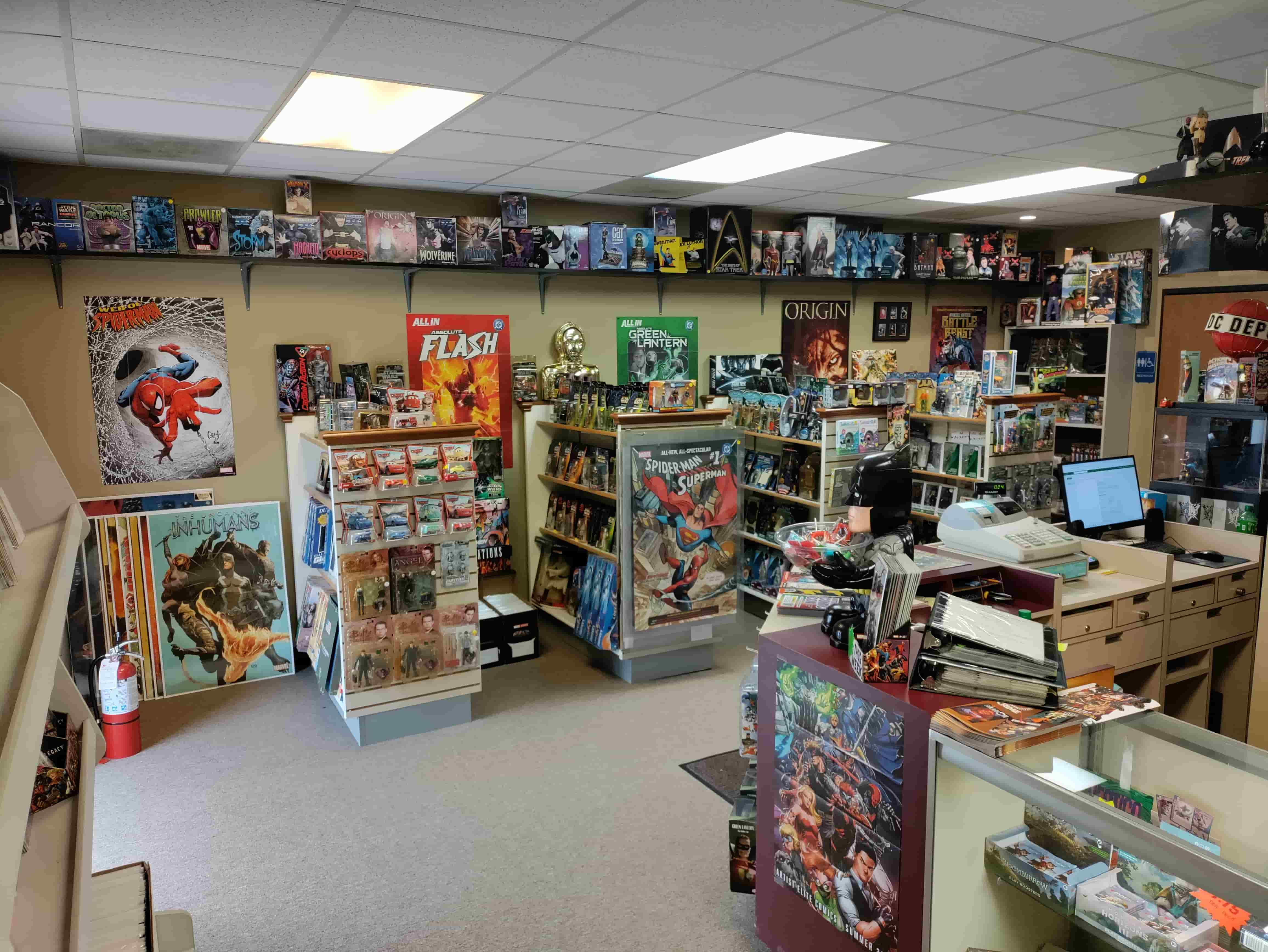 Store interior with collectibles and comics on shelves